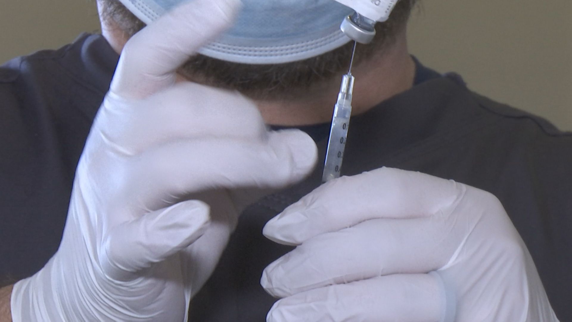 covid vaccine with syringe.jpg